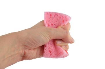 A hand (holding) squeezes pink washing sponge for dishes png isolated