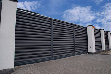 Naklejka premium Automatic sliding metal gate with shutters