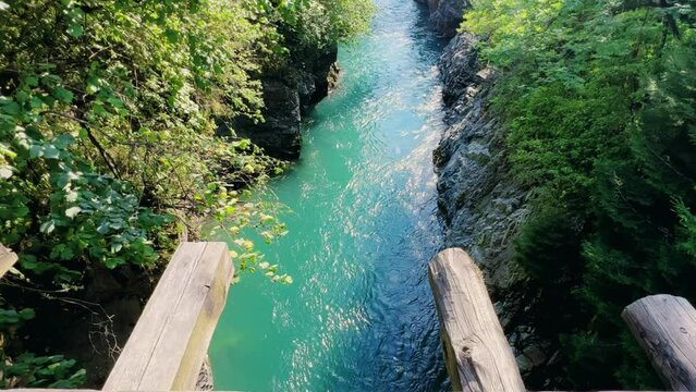 The Bolshaya Laba River. A mountain emerald river in a narrow, sunlit canyon. Bolshaya Laba River near the village of Psemen in Karachay-Cherkessia, Russia. Panoramic view. 4K