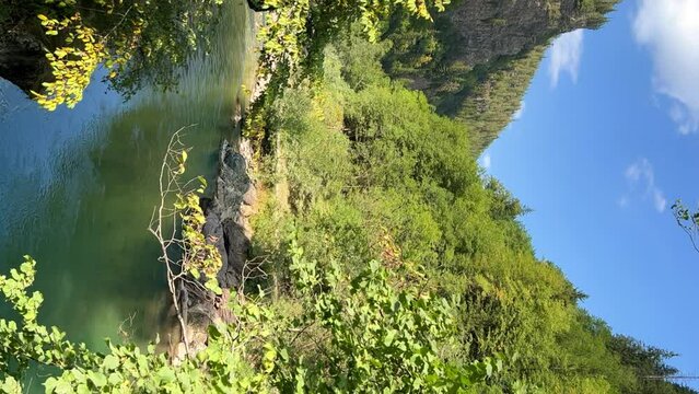 The Bolshaya Laba River. A mountain emerald river in a narrow, sunlit canyon. Bolshaya Laba River near the village of Psemen in Karachay-Cherkessia, Russia. Panoramic view. 4K