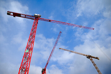 Graceful Cranes Against a Blue Sky: A Symbol of Progress and Growth.