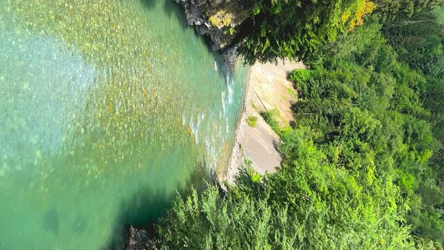 The Bolshaya Laba River. A mountain emerald river in a narrow, sunlit canyon. Bolshaya Laba River near the village of Psemen in Karachay-Cherkessia, Russia. Panoramic view. 4K