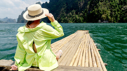 Girl on a raft on chao lan lake in thailand