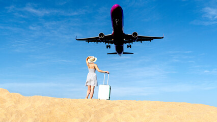 Fototapeta na wymiar girl on the beach with a suitcase and an airplane
