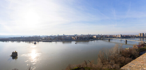 Panoramic view of cityscape of Novi Sad, bridge over Danube river. Downtown at riverside. Cloudy...