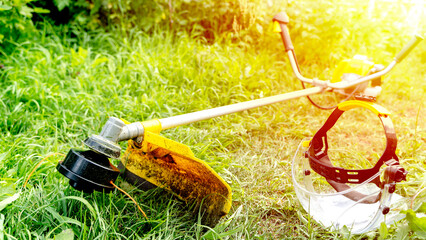 grass trimmer on green grass in