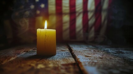 Solitary candle flame burns against the backdrop of the American flag in a dim room - obrazy, fototapety, plakaty