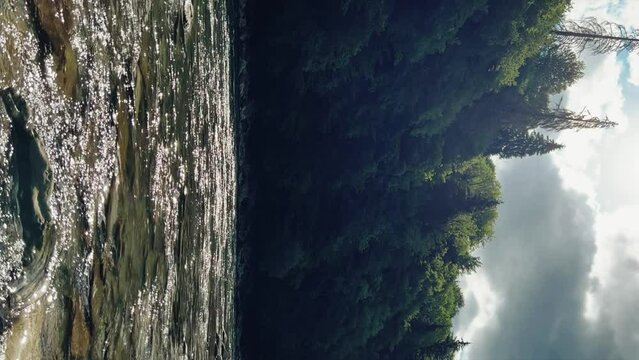The Bolshaya Laba River. A mountain emerald river in a narrow, sunlit canyon. Bolshaya Laba River near the village of Psemen in Karachay-Cherkessia, Russia. Panoramic view. 4K