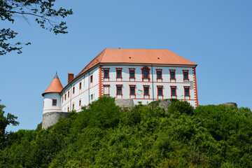 Fototapeta na wymiar Ozalj castle on the hill against blue sky
