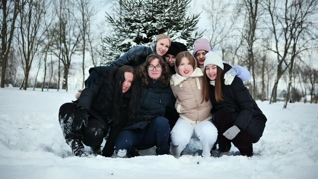 Fun high school friends posing on a winter day.