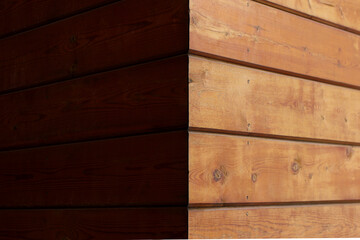 the textural part is the construction of the building wall made of wooden panels