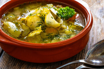 Cucumber soup on wooden table
