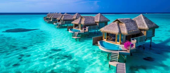  An aerial view on Tropical paradise.Luxury panorama view on Maldives resort on seascape background. Bungalow, villas on beautiful exotic beach on the ocean. Honeymoon. Generative ai © Inai