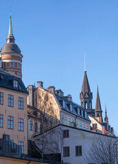 Obraz premium The house Laurinska huset with a brick tower in the district Mariaberget, a sunny winter day in Stockholm