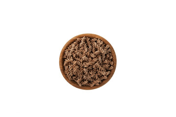 Pasta di Lino in wooden plate on white background, top view. Gluten-free pasta made from flaxseed flour. Low glycemic index food