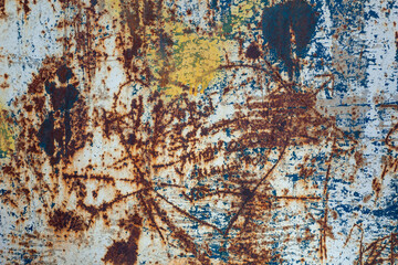 old, rusted, scratched, scratched metal surface with spray paint