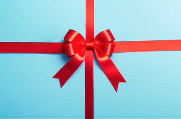 Red bow on Blue Background, a Gift close-up, wallpaper background, Splash Screen for Holiday or Present Package Design.