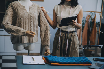 Fototapeta premium Young woman small business owner working at home office. Online marketing packaging delivery, startup SME entrepreneur or freelance woman concept. Small business owener