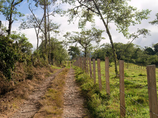 Fototapeta na wymiar Morning view of a typical rural road made with gravel and stones, in the eastern highlands of central Colombia, near the town of Arcabuco.