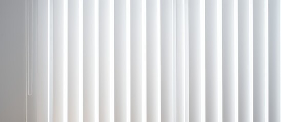 A detailed view of white vertical blinds covering a window on a wall. The slats are neatly arranged, casting shadows on the surface. - obrazy, fototapety, plakaty