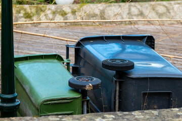 overturned garbage cans in the city