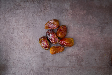 Delicious medjool dates ( kurma ) or sweet dried dates on a plate, as a meal for breaking the fast, ramadan kareem
