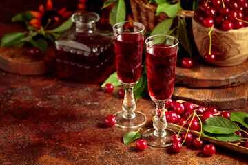 Obraz na płótnie Canvas Cherry liquor and ripe juicy berries.