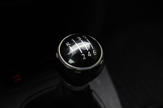 Manual gear shifter. Manual gearbox in the car. Manual gearbox handle. Six speed gear stick in car.