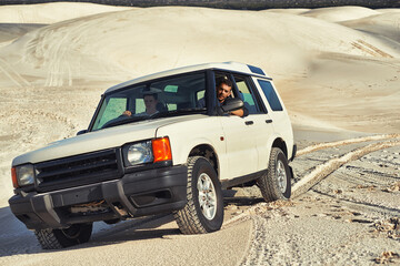 Car, desert and people driving for travel and transportation outdoor, off road vehicle for sand dunes and journey on vacation. Van, 4x4 or SUV with adventure, explore destination and tourism in Dubai - obrazy, fototapety, plakaty