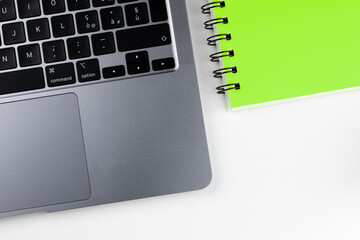 Laptop with block notes and pen