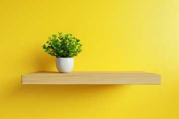 Mockup of a yellow wall with an empty wooden shelf and a plant