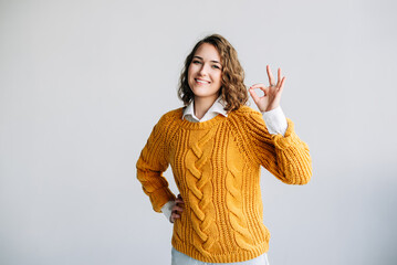 Confident Woman Showing OK Gesture. Smiling, Happy Model Gives Recommendation with Hand Sign -...