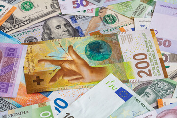 Closeup of  Swiss franc, US dollar, Euro, polish zloty banknotes  banknotes