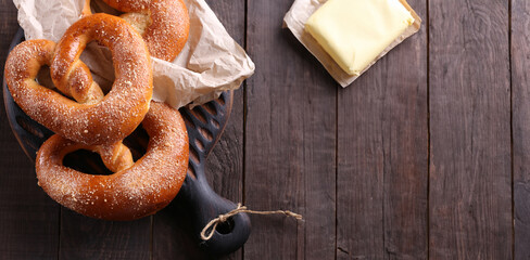 traditional pretzel buns on a wooden board