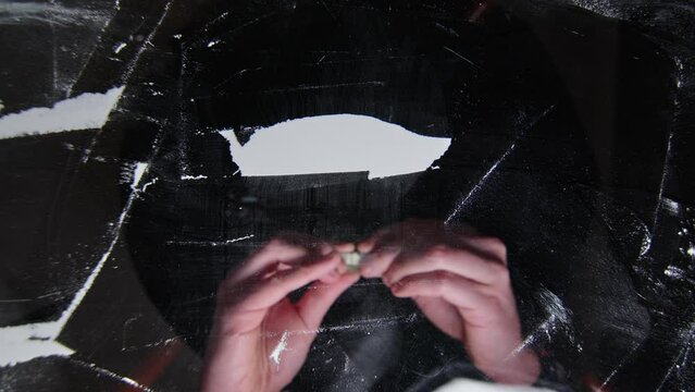 Hand rolls 100 dollars with cocaine snorted on a glass, drug addiction