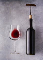 Still life. glass and bottle of wine to uncork. Textured background. - 754337901