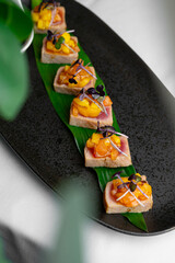 In an upscale restaurant, a beauty enjoys seafood, whiskey, and wine. Kamchatka crab and premium caviar elevate sushi. A tasty octopus is a treat. The bartender and sommelier expertly pair wines 