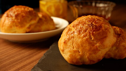 Scone on stone plate and strawberry jam