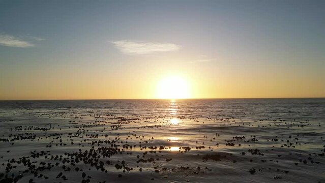 Scenic view of Melkboss looking over the water into the sunset