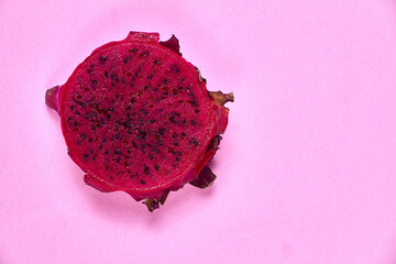 Red dragon fruit Set with appetizing serving on pink background. Top view