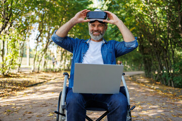 Tech-Enabled Freedom: Person with Disabilities Engages AR with Laptop in Park