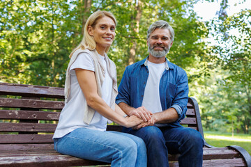 Fototapeta premium Park Perfection: Lovebirds on a Bench