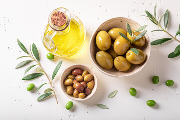 Tasty and bio olives with olive berries and branch.