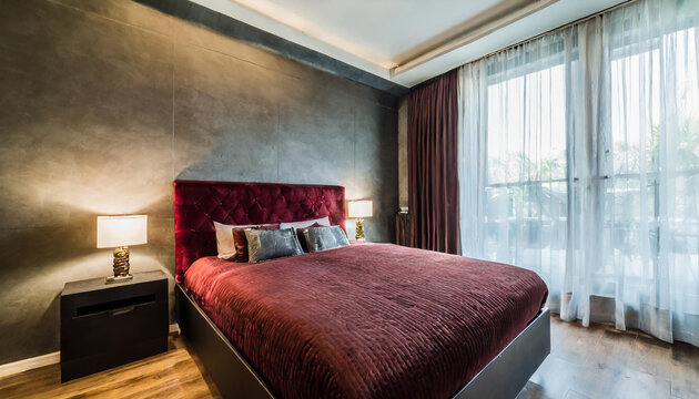 Deep dark master bedroom with big burgundy red bed. Mix colors - maroon, black, grey and brown. Empty painted accent wall. Luxury room design home or hotel