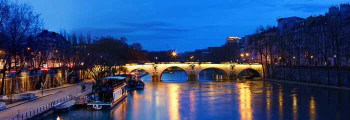 The view of bridge Ponte Marie over Seine river at night , Paris, France. It is one of the oldest bridges in Paris. - 754387511