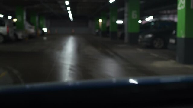 car ithe car is moving through an underground parking lot. blurred picture bokeh effect