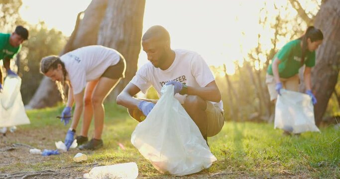 Volunteer, teamwork and garbage or environment sustainability or climate change recycling or nature, cleaning or community service. People, bag and plastic on earth day, nonprofit or waste management