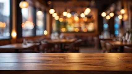  Warm, polished wooden table in focus. Blurred bar interior with bokeh lights in the background. Ideal for product display and ad design © rex