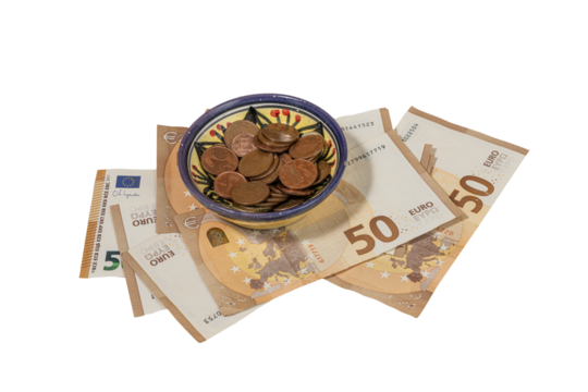 some euro pennies in a decorated bowl and some banknotes - Powered by Adobe