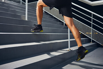 Athlete man running on stairs during interval training